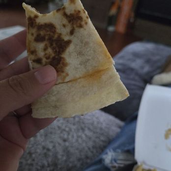 Taco Bell - My quesadilla.   All tortilla.  Stock photo has it full of chicken...all the way to the edges. - Fast Food Near Me - Bowie, Maryland