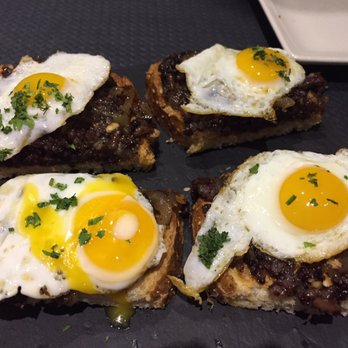 La Molona - Morcilla (blood sausage) with quail eggs - Tapas Bars Near Me - Seville, SE La Molona - Morcilla (blood sausage) with quail eggs - Tapas Bars Near Me - Seville, SE