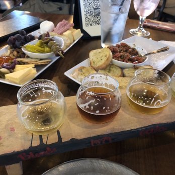Parker County Brewing - A half-drank flight of house beer, half - eaten bruschetta, and a small charcuterie platter - perfect shared lunch. - Breweries Near Me - Willow Park, Texas Parker County Brewing - A half-drank flight of house beer, half - eaten bruschetta, and a small charcuterie platter - perfect shared lunch. - Breweries Near Me - Willow Park, Texas