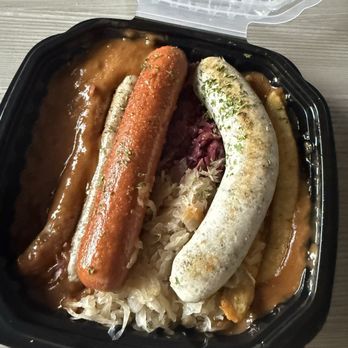 Munich Haus - Hubie's Platter to go.  Knockwurst, Pfalzer, Nurnberger & Chicken Bratwursts. Served with pan gravy, red cabbage, and sauerkraut. - German Near Me - Chicopee, Massachusetts