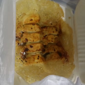 Ping's Dumpling House - The pot stickers with the amazing characters made of oil and flour. It is amazing. - Dim Sum Near Me - Seattle, Washington Ping's Dumpling House - The pot stickers with the amazing characters made of oil and flour. It is amazing. - Dim Sum Near Me - Seattle, Washington