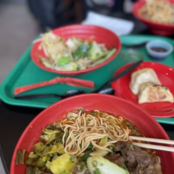 Zoe Ma Ma - a bowl of beef and noodles with chopsticks - Dim Sum Near Me - Denver, Colorado