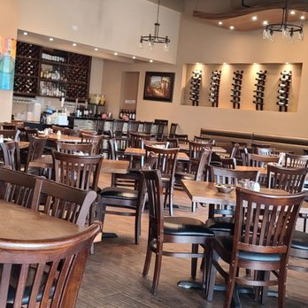 Gianni’s Italian Bistro - a dining area with tables and chairs - Italian Near Me - Heath, Texas Gianni’s Italian Bistro - a dining area with tables and chairs - Italian Near Me - Heath, Texas