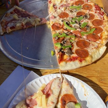 Front Street Station - a slice of pepperoni pizza on a paper plate - Pizza Near Me - Tahoe City, California Front Street Station - a slice of pepperoni pizza on a paper plate - Pizza Near Me - Tahoe City, California