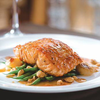 The Capital Grille - Seared Salmon featuring our housemade citrus glaze, French green beans with brown butter and Marcona almonds. - Steakhouses Near Me - Burbank, California The Capital Grille - Seared Salmon featuring our housemade citrus glaze, French green beans with brown butter and Marcona almonds. - Steakhouses Near Me - Burbank, California