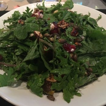 BJ's Restaurant & Brewhouse - Kale and roasted Brussels sprouts salad with nuts, cranberries and blueberries - Pizza Near Me - Cedar Park, Texas