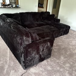 Discount Furniture Outlet - Black sectional with pull out sleeper