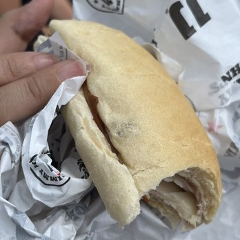 Jimmy John's - a hand holding a half eaten sandwich - Sandwiches Near Me - Rosemount, Minnesota Jimmy John's - a hand holding a half eaten sandwich - Sandwiches Near Me - Rosemount, Minnesota