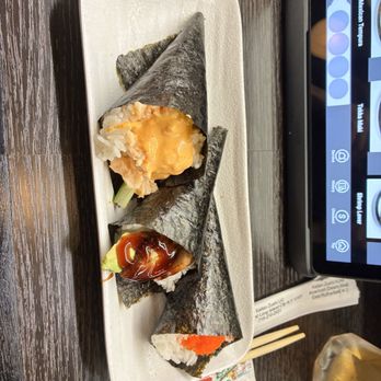 Kaiten Zushi - Left to right: spicy shrimp, eel & avocado, and masago handrolls - Sushi Bars Near Me - New York, New York Kaiten Zushi - Left to right: spicy shrimp, eel & avocado, and masago handrolls - Sushi Bars Near Me - New York, New York