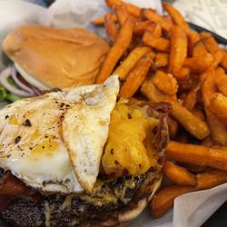 Ground Restaurant - Build your own, with thick Smokey bacon, cheddar, over easy egg, and thousand island. Side of sweet potato fries.