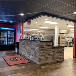 Fox's Pizza Den - Great food! Here is the Cashiers desk with protective shield.