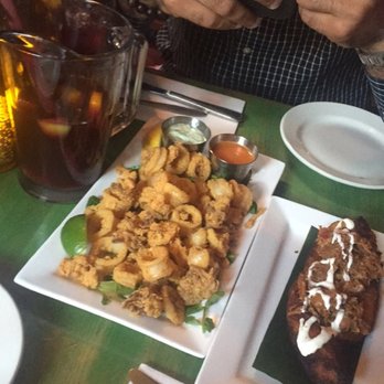Yuca Bar - sangria pitcher, fried calamari, and plantain relleno with shredded pork - Latin American Near Me - New York, New York Yuca Bar - sangria pitcher, fried calamari, and plantain relleno with shredded pork - Latin American Near Me - New York, New York