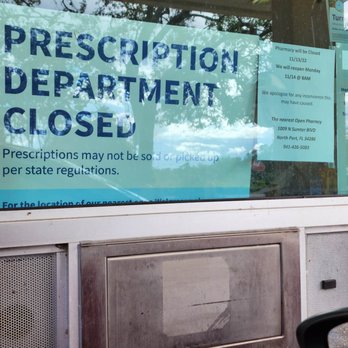 Walgreens - a sign in a window of a store - Drugstores Near Me - North Port, Florida Walgreens - a sign in a window of a store - Drugstores Near Me - North Port, Florida
