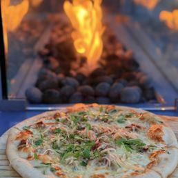 Longanisa Pizza Sweet and Savory Sausage Topped with Atchara and Micro Cilantro; Chef's Monthly Special
