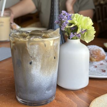 Between Us - Iced Black Sesame Latte with hojicha shot / Instagram @judeethefoodee - Breakfast & Brunch Near Me - San Diego, California