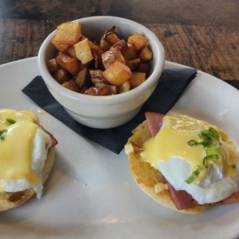 Maxine's Gumbo House - Eggs Benedict with hollandaise sauce, Ham, and english muffin with a side of home fries. - Cajun/Creole Near Me - Manor, Texas Maxine's Gumbo House - Eggs Benedict with hollandaise sauce, Ham, and english muffin with a side of home fries. - Cajun/Creole Near Me - Manor, Texas