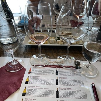 Fortunati Vineyards - a table with wine glasses and a menu - Wineries Near Me - Napa, California Fortunati Vineyards - a table with wine glasses and a menu - Wineries Near Me - Napa, California