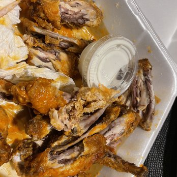 Hooters - chicken wings in a styrofoam container - American Near Me - Lexington, Kentucky
