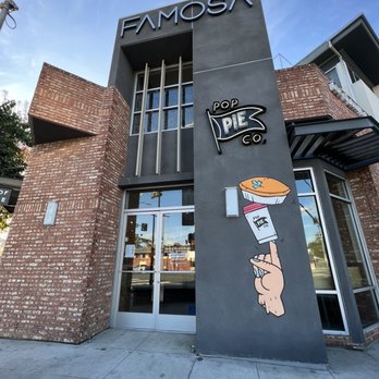 Pop Pie - a hand holding a pizza - Bakeries Near Me - San Diego, California Pop Pie - a hand holding a pizza - Bakeries Near Me - San Diego, California
