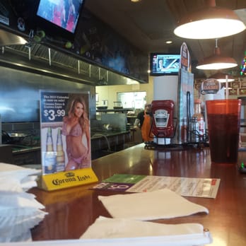 Hooters - A shot from the bar where I ordered my wing plate... - Sports Bars Near Me - Melrose Park, Illinois