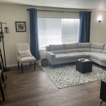 Monster Maintenance Solutions - a living room with a sectional couch - General Contractors Near Me Monster Maintenance Solutions - a living room with a sectional couch - General Contractors Near Me