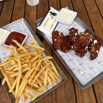 Truly Pizza - Fries + Harissa Honey Chicken Wings - Pizza Near Me - Dana Point, California Truly Pizza - Fries + Harissa Honey Chicken Wings - Pizza Near Me - Dana Point, California