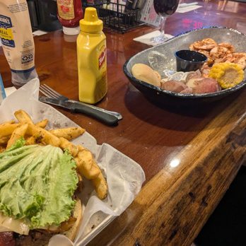 Bahama Bobs - Burger in the foreground, steamed shrimp in the background - Seafood Near Me - Gulf Shores, Alabama Bahama Bobs - Burger in the foreground, steamed shrimp in the background - Seafood Near Me - Gulf Shores, Alabama