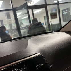 Orange Avenue Laundromat - cleaning lady rushing the young man to get out. He had that green trash can and was putting all his clean clothes away