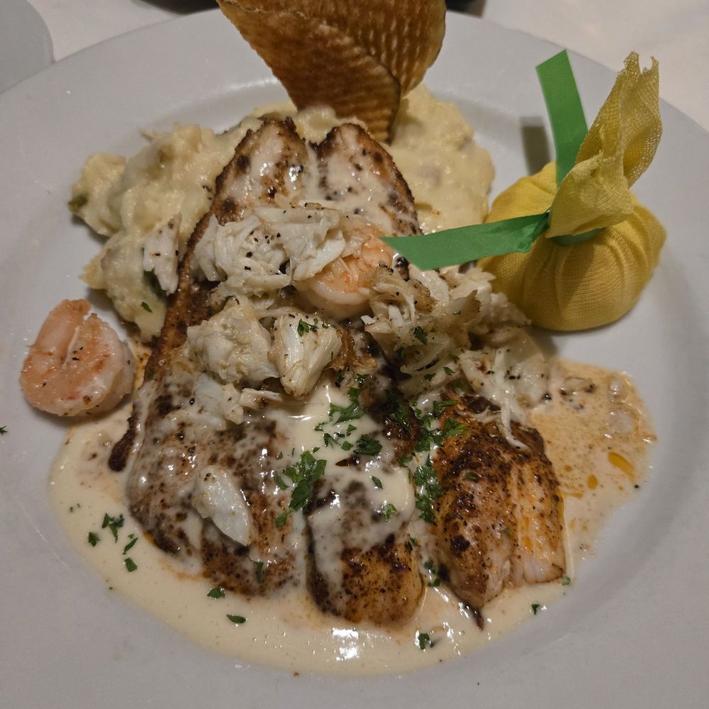 Steve Fields - Red Fish w/garlic butter sauce (includes shrimp and crab) and mashed potatoes - Steakhouses Near Me - Plano, Texas Steve Fields - Red Fish w/garlic butter sauce (includes shrimp and crab) and mashed potatoes - Steakhouses Near Me - Plano, Texas