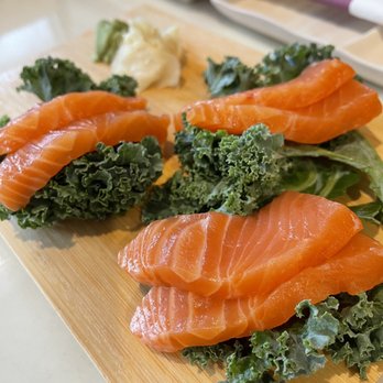 Wabi Sabi - salmon and kale on a cutting board - Sushi Bars Near Me - Chicago, Illinois Wabi Sabi - salmon and kale on a cutting board - Sushi Bars Near Me - Chicago, Illinois