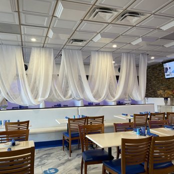 Galini Greek Restaurant - tables and chairs with white drapes - Mediterranean Near Me - Boca Raton, Florida Galini Greek Restaurant - tables and chairs with white drapes - Mediterranean Near Me - Boca Raton, Florida