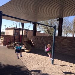 Continental Ranch Community Park - Kid swings (foreground) & playscape (background) with the awning overhead
