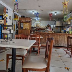 Los Platos Rotos - A few tables are inside the restaurant but most are on the covered patio.