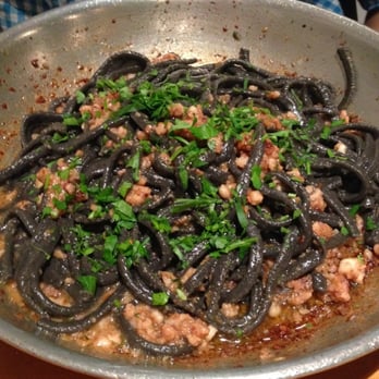 The Daily Catch - Aglio Olio- a fresh, homemade black linguine made with squid ink, ground calamari, olive oil, garlic, and anchovy. - Italian Near Me - Boston, Massachusetts The Daily Catch - Aglio Olio- a fresh, homemade black linguine made with squid ink, ground calamari, olive oil, garlic, and anchovy. - Italian Near Me - Boston, Massachusetts