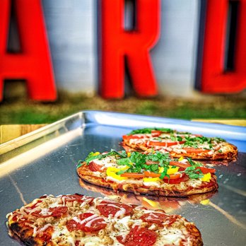 Bowstring Pizza and Brewyard - two pizzas on a tray - Bars Near Me - Raleigh, North Carolina Bowstring Pizza and Brewyard - two pizzas on a tray - Bars Near Me - Raleigh, North Carolina