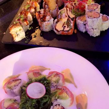 Sono Asian - Cherry blossom roll with seaweed salad at the bottom. At top, left to right: Phoenix, shrimp tempura, crazy maki, salmon, spicy tuna. - Asian Fusion Near Me - Arlington, Massachusetts Sono Asian - Cherry blossom roll with seaweed salad at the bottom. At top, left to right: Phoenix, shrimp tempura, crazy maki, salmon, spicy tuna. - Asian Fusion Near Me - Arlington, Massachusetts
