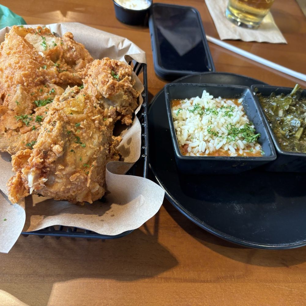 Fried Chicken- kinda dry and crusty not much flavor. Red Beans and Rice- yum! Greens yum!