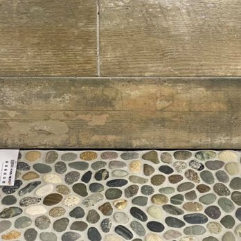 The Tile Shop - This is the wood-like wall tile we selected, along with the pebble shower floor tile - Flooring Near Me - Sterling, Virginia