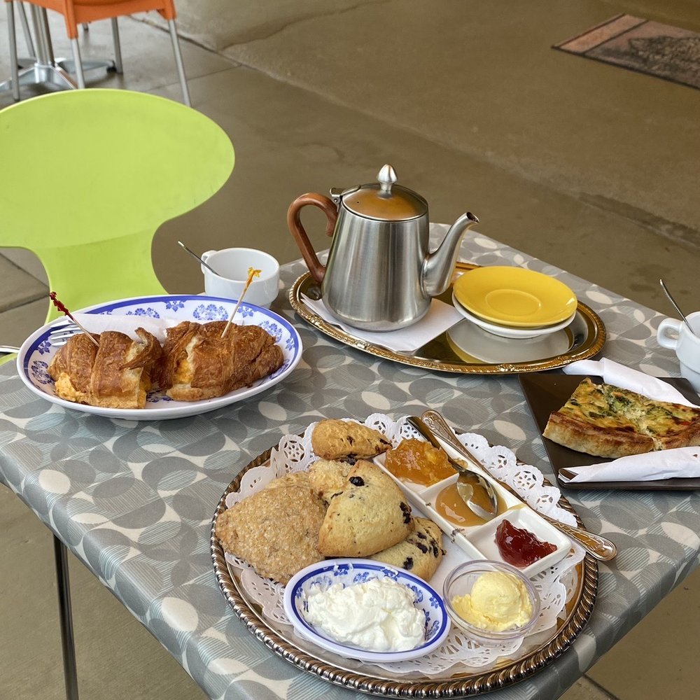 a table with a variety of breakfast foods on it a table with a variety of breakfast foods on it
