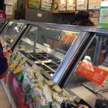 Subway - a woman standing in front of a deli counter - Sandwiches Near Me - Opelousas, Louisiana Subway - a woman standing in front of a deli counter - Sandwiches Near Me - Opelousas, Louisiana