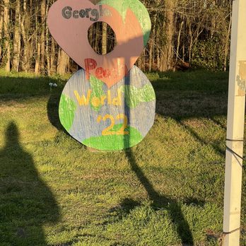 Georgia Peach World - Kids can take pictures behind the wooden peach - Specialty Food Near Me - Richmond Hill, Georgia Georgia Peach World - Kids can take pictures behind the wooden peach - Specialty Food Near Me - Richmond Hill, Georgia