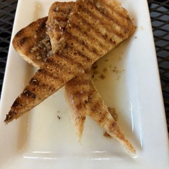 TAPAteria - Pan Con Ajo (minus a piece I had to dive into) - Spanish Near Me - Colorado Springs, Colorado TAPAteria - Pan Con Ajo (minus a piece I had to dive into) - Spanish Near Me - Colorado Springs, Colorado