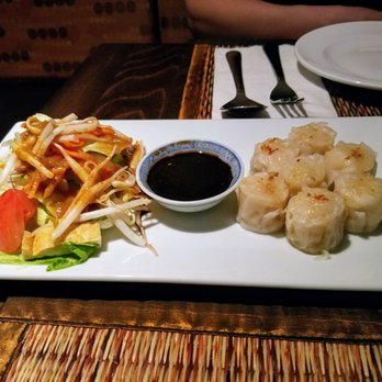 Taste of Thai - Steamed shrimp dumplings with a side salad drizzled with peanut sauce. - Thai Near Me - Basking Ridge, New Jersey Taste of Thai - Steamed shrimp dumplings with a side salad drizzled with peanut sauce. - Thai Near Me - Basking Ridge, New Jersey