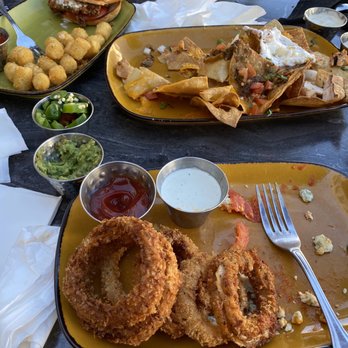 Local Kitchen - Buffalo Chicken Sandwich Tavern Burger Side Onion Rings Haunted Nachos - Cocktail Bars Near Me - Torrance, California