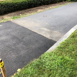See, the repaired section of the driveway looks very obvious.