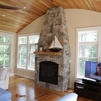Gade Masonry & Landscaping - a living room with a stone fireplace - Landscaping Near Me Gade Masonry & Landscaping - a living room with a stone fireplace - Landscaping Near Me