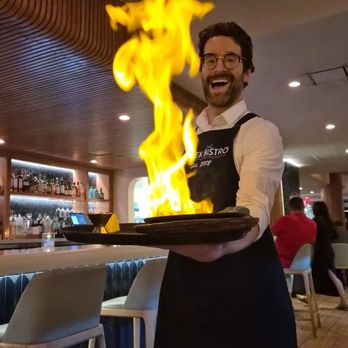 Greek Bistro - Saganaki flame at the table side and the live music is magical - Greek Near Me - Glendale, California Greek Bistro - Saganaki flame at the table side and the live music is magical - Greek Near Me - Glendale, California