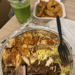 Lemon Mint - A takeout meal includes grilled chicken, beef, rice, a green beverage, and fried chicken wings in a foam container and a plastic cup.