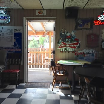 The Spot Tavern - a checkered floor with a table and chairs - Bars Near Me - Topeka, Kansas The Spot Tavern - a checkered floor with a table and chairs - Bars Near Me - Topeka, Kansas