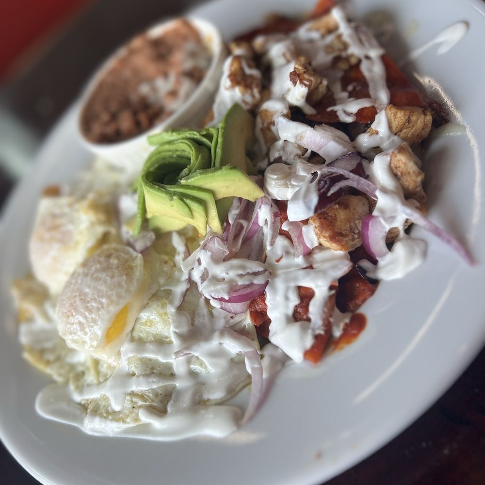 La Wheela - Famous chilaquiles (green with fried egg & red with chicken) served with beans and ordered with avocado - Bikes Near Me - El Paso, Texas